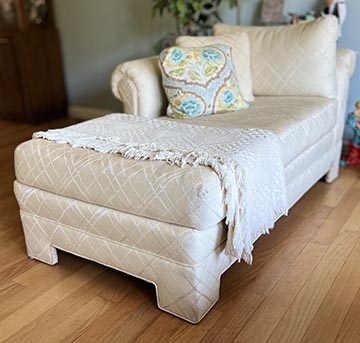 Chaise lounge chair with afghan